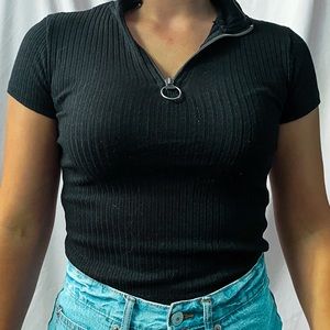 Black short sleeved quarter hoop zip shirt